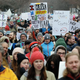 Demonstrators walk through on the West Washington Blvd during a “March for Our Lives” rally in support of gun control, Saturday, March 24, 2018, in Chicago.